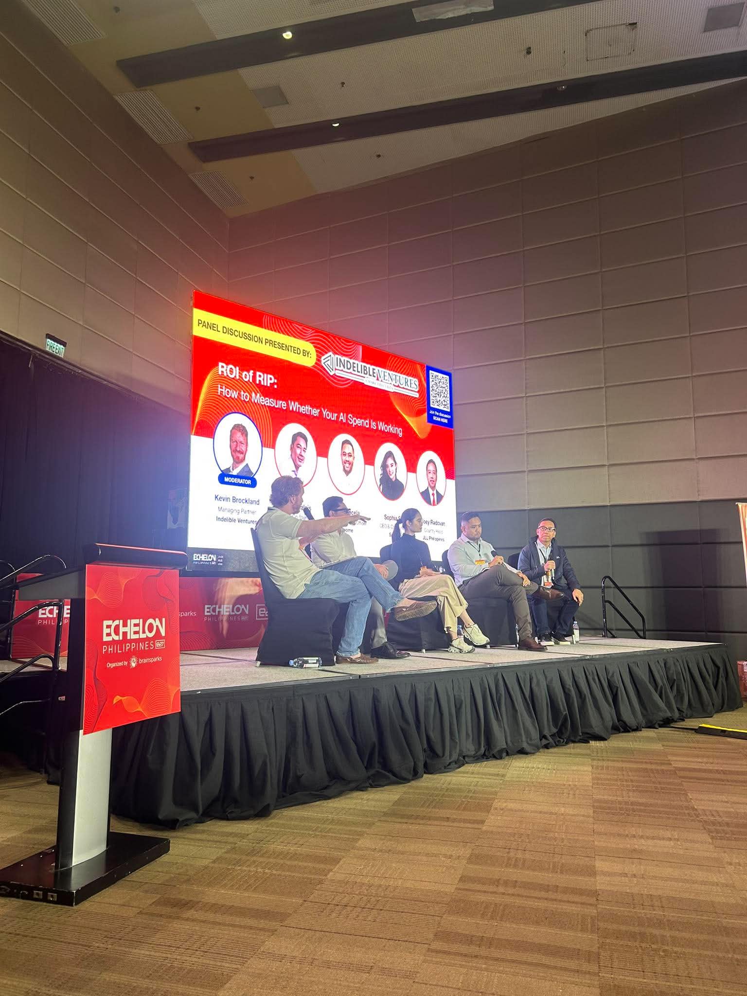 Panelists discussing how to measure return on AI spending
